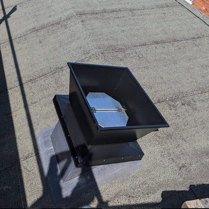 A powder coated vertical roof unit with aluminium internal shutters mounted on a pitched roof | Trivent Ltd UK